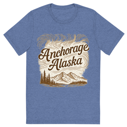 Front view of a Premium Tri-Blend Crew Neck T-Shirt in Blue showing 'A typographic, nostalgic graphic of a typographic illustration of the words 'anchorage, alaska' with a vintage line art drawing of the northern lights'