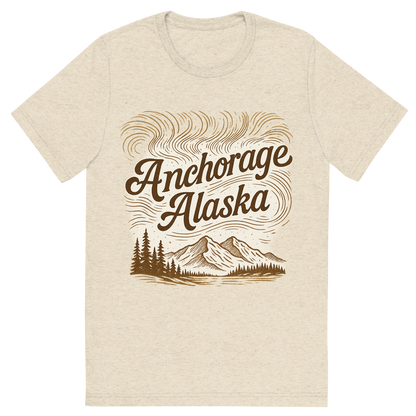 Front view of a Premium Tri-Blend Crew Neck T-Shirt in Oatmeal showing 'A typographic, nostalgic graphic of a typographic illustration of the words 'anchorage, alaska' with a vintage line art drawing of the northern lights'