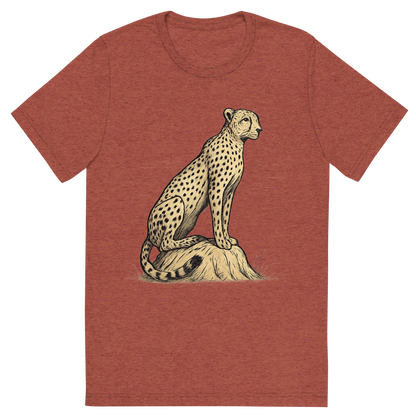 Front view of a Premium Tri-Blend Crew Neck T-Shirt in Clay showing 'A hand-drawn ink with color pops, focused graphic of a sleek cheetah perched atop a termite mound, scanning the horizon with alert eyes, illustrated in hand-drawn ink with soft tan and black details, centered composition, transparent background, optimized for dtg printing'