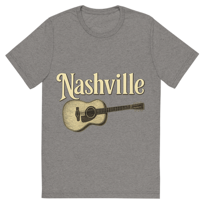 Front view of a Premium Tri-Blend Crew Neck T-Shirt in Grey showing 'A typographic, nostalgic graphic of a typographic illustration of the words 'nashville' with a vintage line art drawing of a guitar'