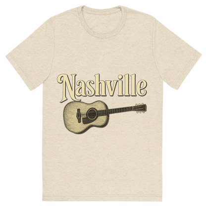 Front view of a Premium Tri-Blend Crew Neck T-Shirt in Oatmeal showing 'A typographic, nostalgic graphic of a typographic illustration of the words 'nashville' with a vintage line art drawing of a guitar'